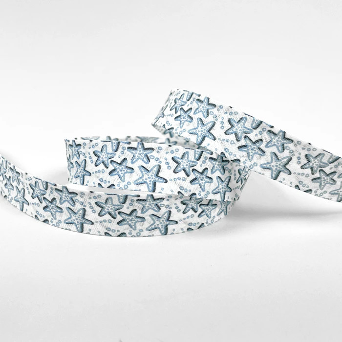 Biais replié 20mm blanc motif étoile de mer au mètre Biais replié 20mm blanc motif étoile de mer au mètre