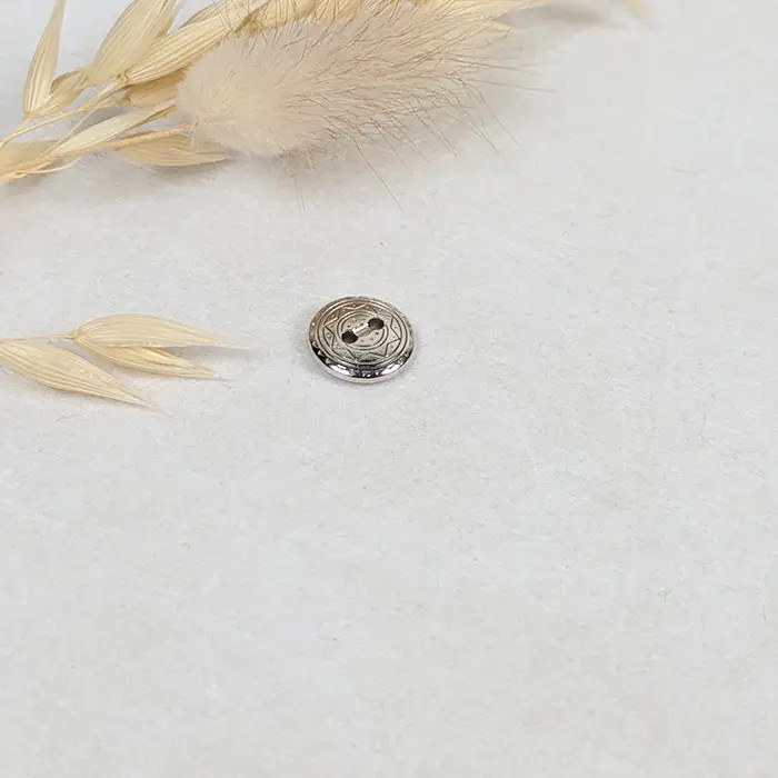 Bouton métal étoile argent 11mm Bouton métal étoile argent 11mm